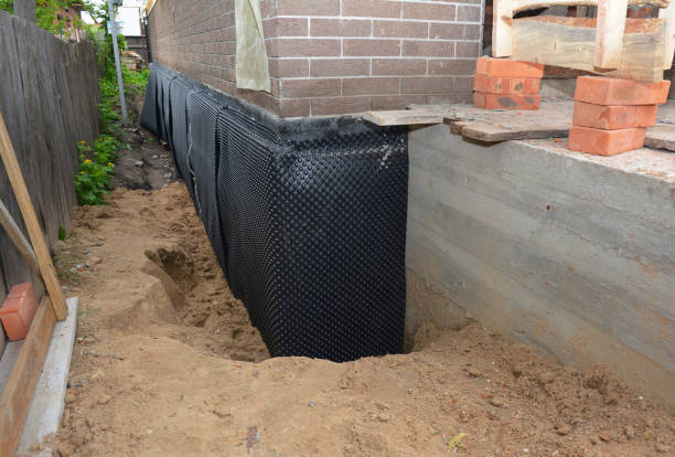 SJ Waterproofing Pros technician performing targeted Sump Pump Installation assessment in Mount Morris, IL